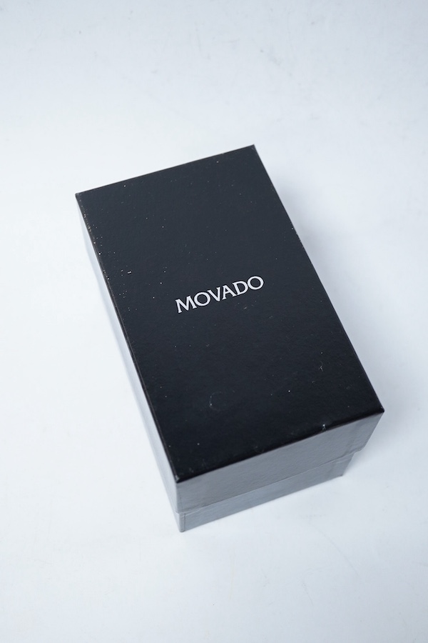 A modern steel and gold plated Movado quartz wrist watch, case diameter 37mm including the winding crown, with original box and booklet. Condition - fair to good
